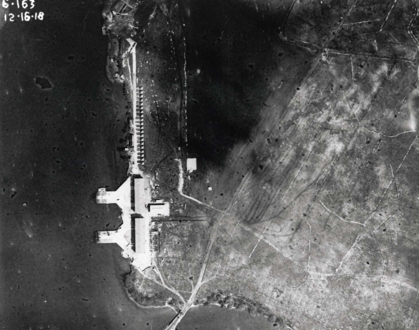 Aerial photo looking straight down on the seaplane hangars and ramps at Luke Field on Ford Island in Pearl Harbor, Hawaii, Dec 26, 1918.