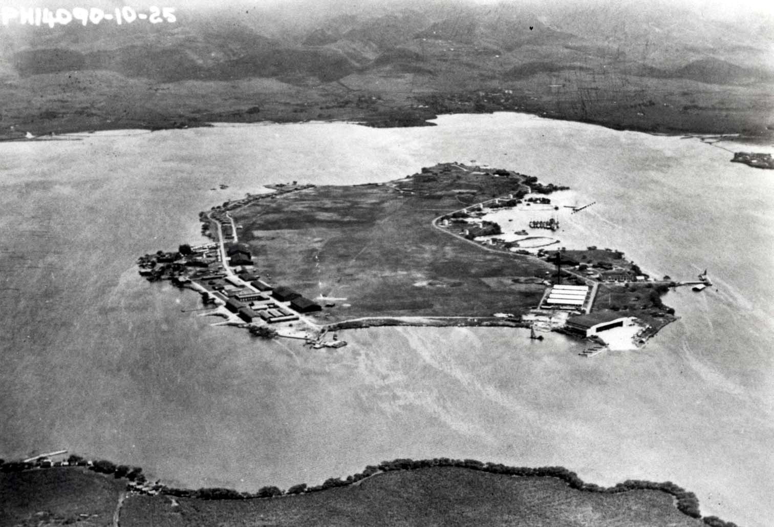 Ford Island in Pearl Harbor, Hawaii looking East.  The Army’s Luke Field facilities are at left and the Navy’s Air Station at right, Mar 25, 1925.