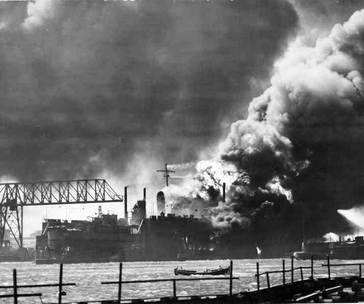 Floating Drydock YFD-2 with destroyer USS Shaw in flames following the explosion in Shaw’s forward magazine, Pearl Harbor, Oahu, Hawaii, Dec 7, 1941.