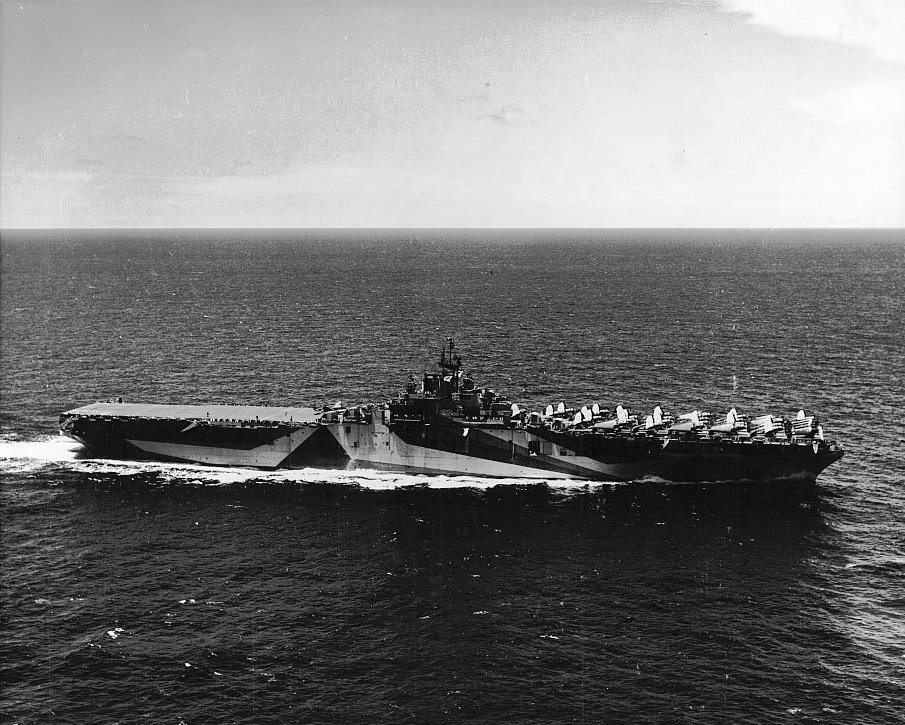Starboard side view of USS Ticonderoga as she steamed off Puerto Rico toward Trinidad on her shakedown cruise, Jun 29, 1944. Note original length of the flight deck short of the bow, extended to cover bow 2 months later.