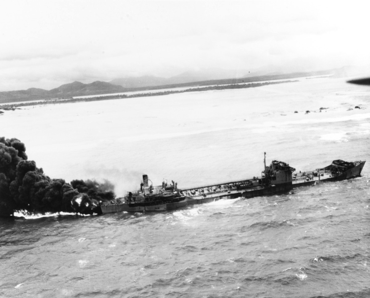 Large Type 2TL tanker Kyokuun Maru on fire and making for the beach off the coast of French Indochina (Vietnam) north of Qui Nhon after its convoy was attacked by 175 United States Navy carrier planes, Jan 12, 1945.
