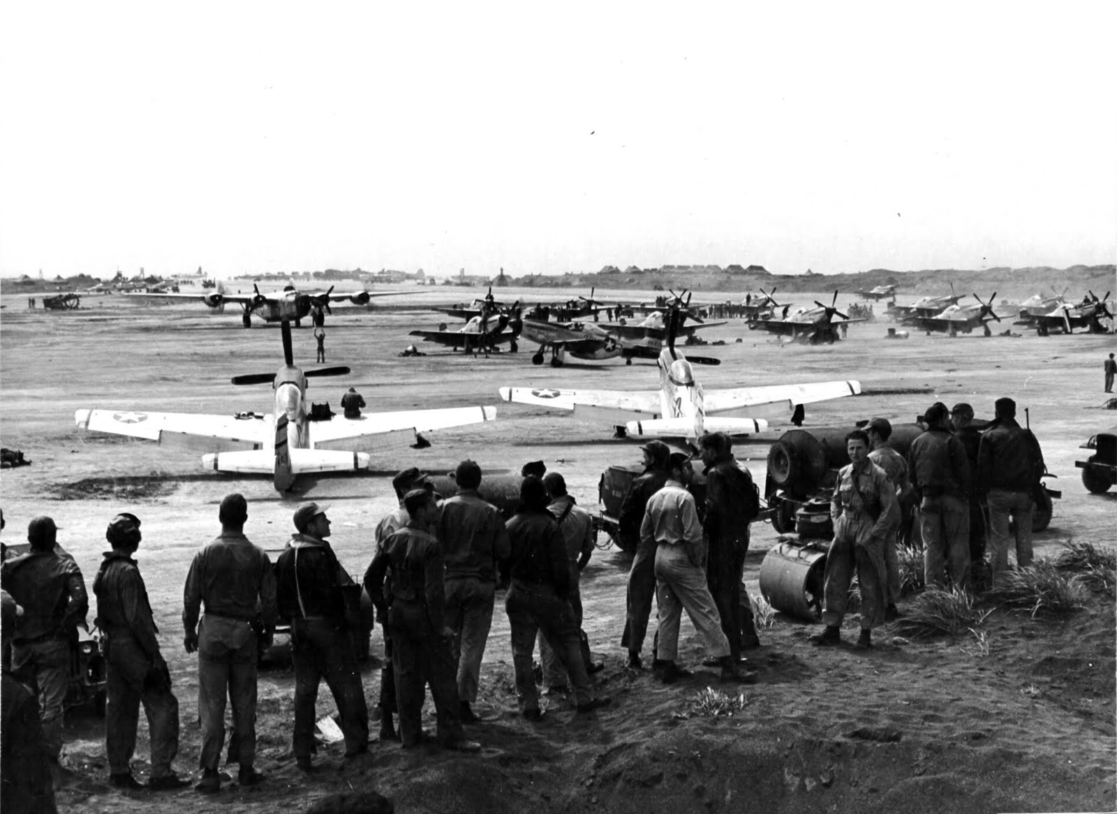 P-51D Mustangs of the 47th & 531st Fighter Squadrons at South Field, Iwo Jima, May-July 1945. Note also the PB4Y-1 Liberator of Navy Patrol Squadron VPB-116.