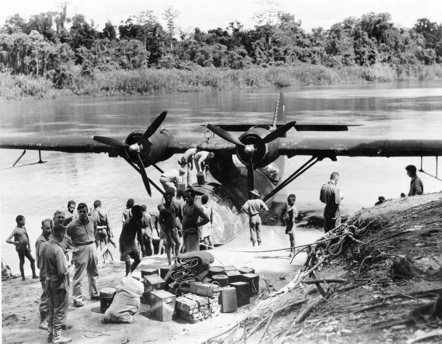A PBY-5 Catalina of US Navy Patrol Squadron VP-11 on the Sepik River in Australian New Guinea bringing supplies to a coast-watcher working in the area, Jan 1943