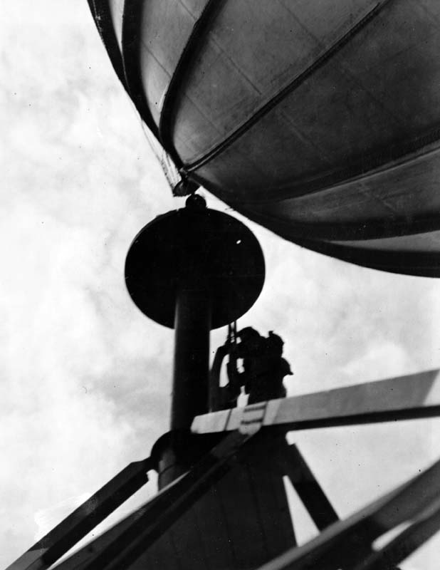 Nose of US Navy blimp K-11, Airship Patrol Squadron ZP-11, being secured to a mooring mast during a storm at NAS South Weymouth, Massachusetts, United States, Sep 27, 1942.