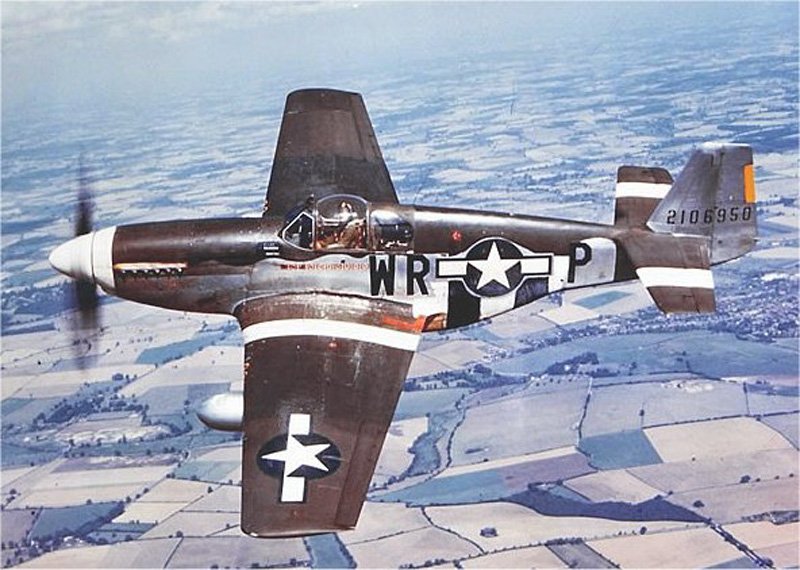 'The Iowa Beaut,' a P-51B of the 354th Fighter Squadron flown over the English countryside by Lt Robert E Hulderman, mid-1944. A different pilot in this plane was lost near Rechtenbach, Germany, Sep 11, 1944
