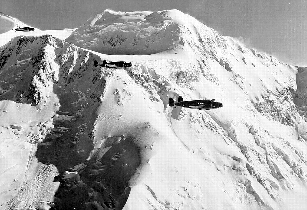 Three Lockheed A-29 Hudsons fly past Mt McKinley, Territory of Alaska, circa 1942