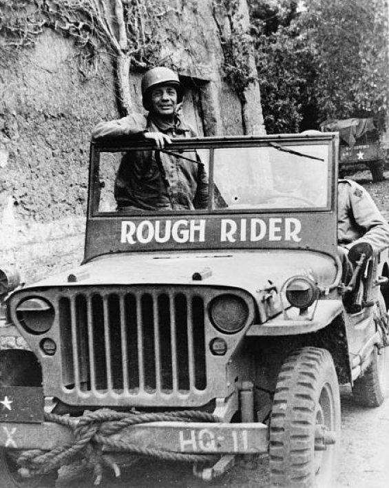 Brigadier General Theodore Roosevelt, Jr. in his Jeep 'Rough Rider' near the front lines in Normandy, Jun 1944.