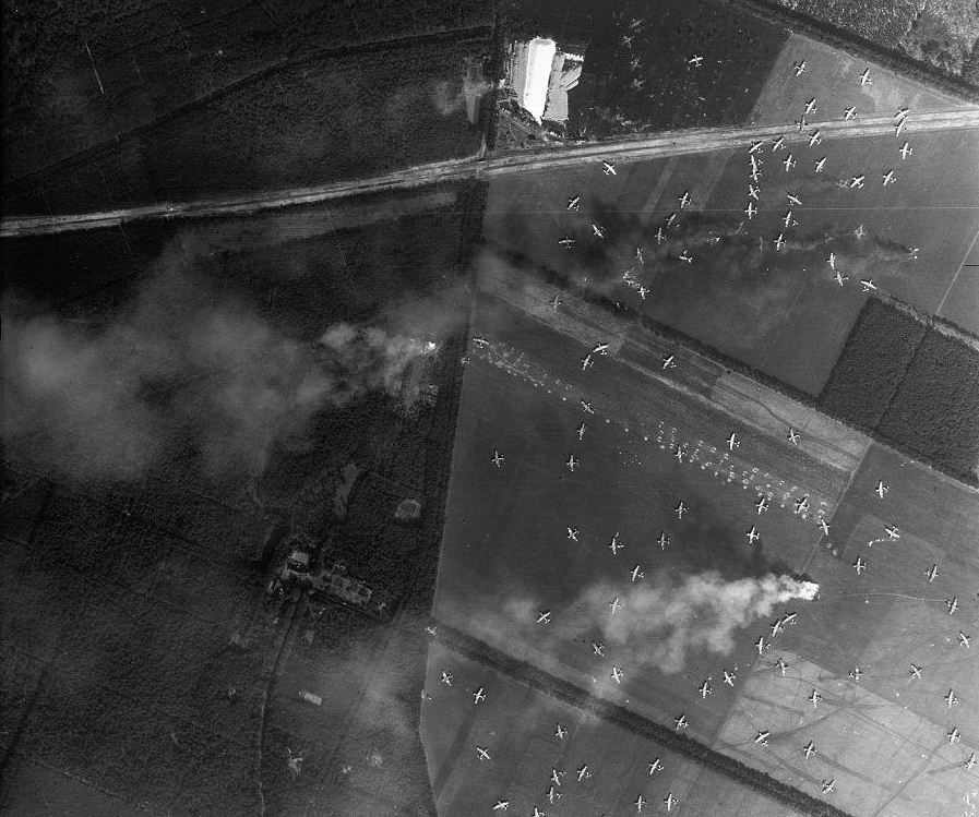 Horsa gliders litter Landing Zone 'S' near Arnhem, Netherlands as part of Operation Market Garden, Sep 17, 1944. Note that some of the gliders are burning.