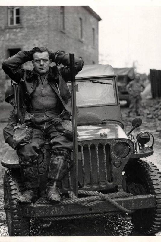 Captured German pilot who was shot down by anti-aircraft fire near Weisweiler, Germany, fall 1944.