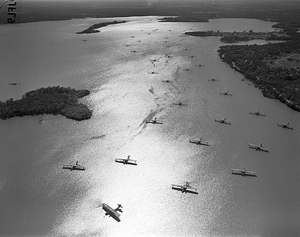 Nearly 30 PBY Catalina flying boats at anchor, 1940s, location unknown