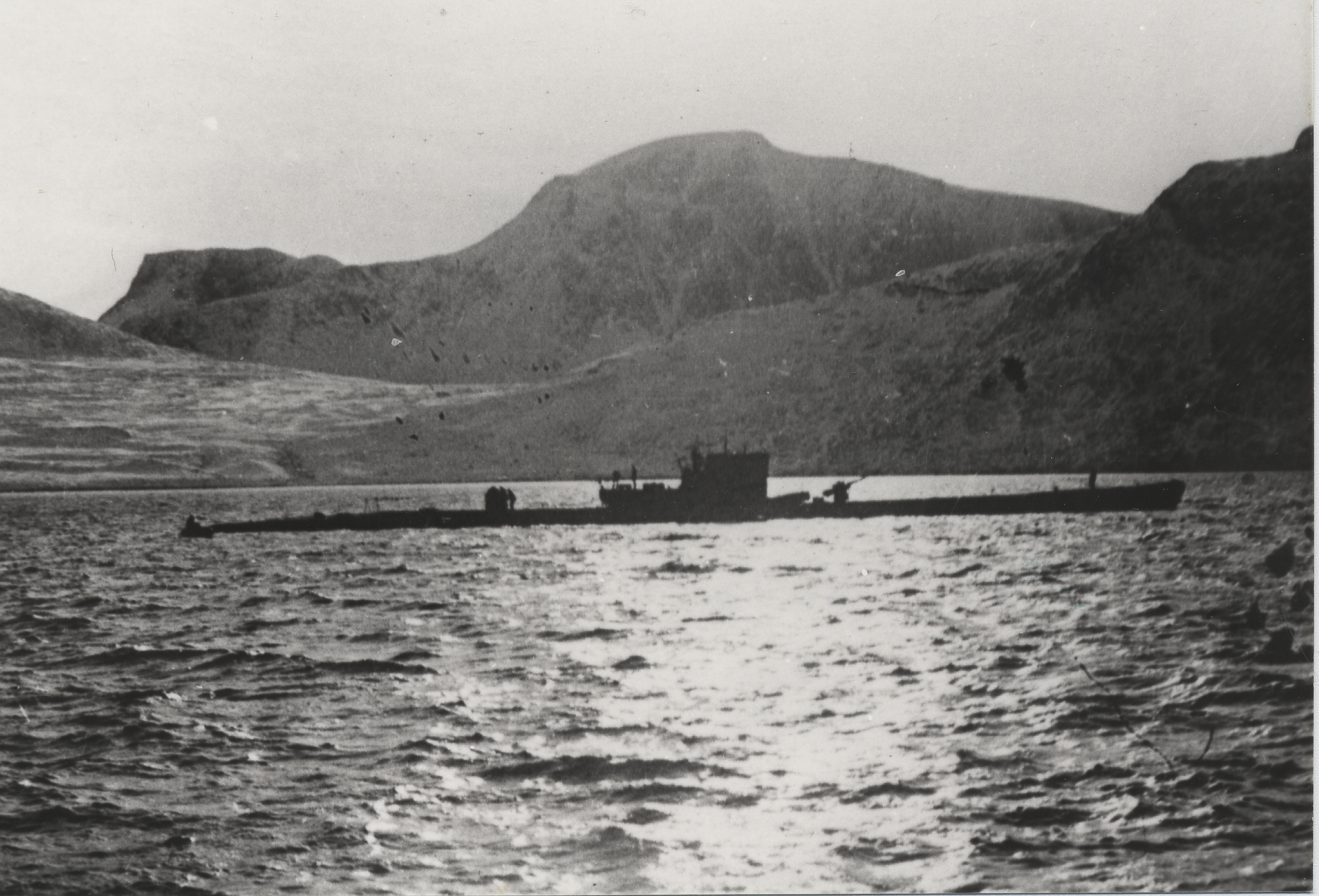 Type IXC/40 submarine U-537 at anchor in Martin Bay, Labrador, Dominion of Newfoundland (now Canada) on 22 Oct 1943. Crewmen can be seen on deck offloading components of Weather Station Kurt into rubber rafts.