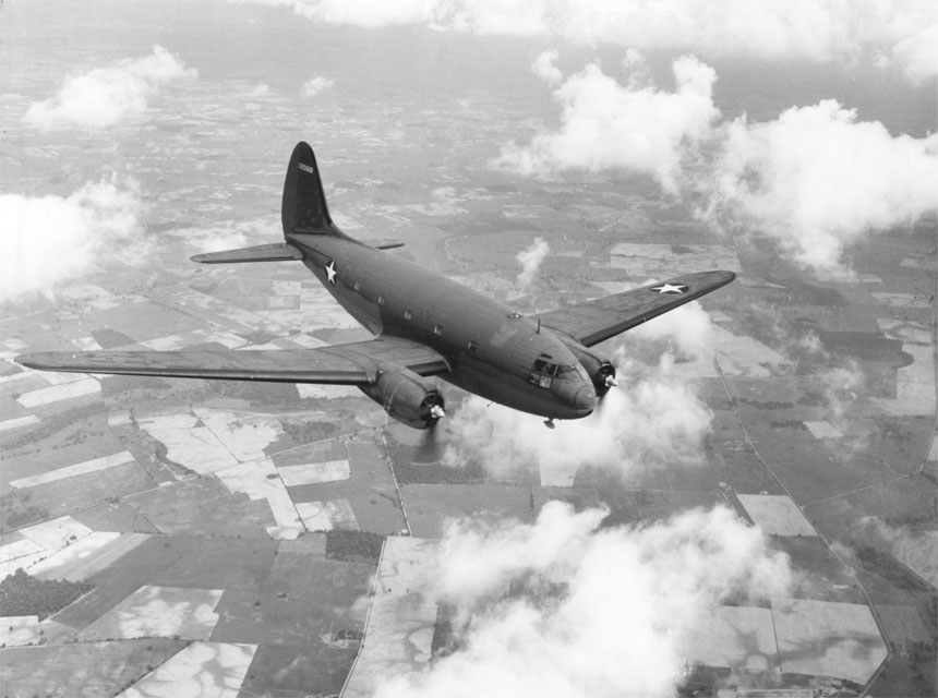 Curtiss C-46 Commando in flight, early 1943, probably over the United States.