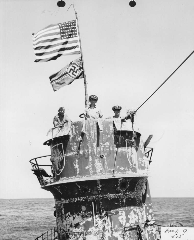 US Navy officers on the bridge of the captured U-505, 14 Jun 1944, Cdr Earl Trosino, Capt Daniel Gallery, and Lt(jg) Albert David. The U-505 was captured by Capt Gallery’s hunter group built around the USS Guadalcanal
