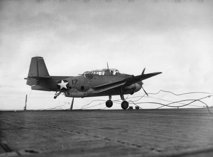 TBF-1 Avenger landing on Auxiliary Carrier USS Card bounced over the arresting cables, crashed the barrier, and stopped in an anti-aircraft gun tub, 9 Dec 1942 off San Diego, California, United States. 1 of 2.