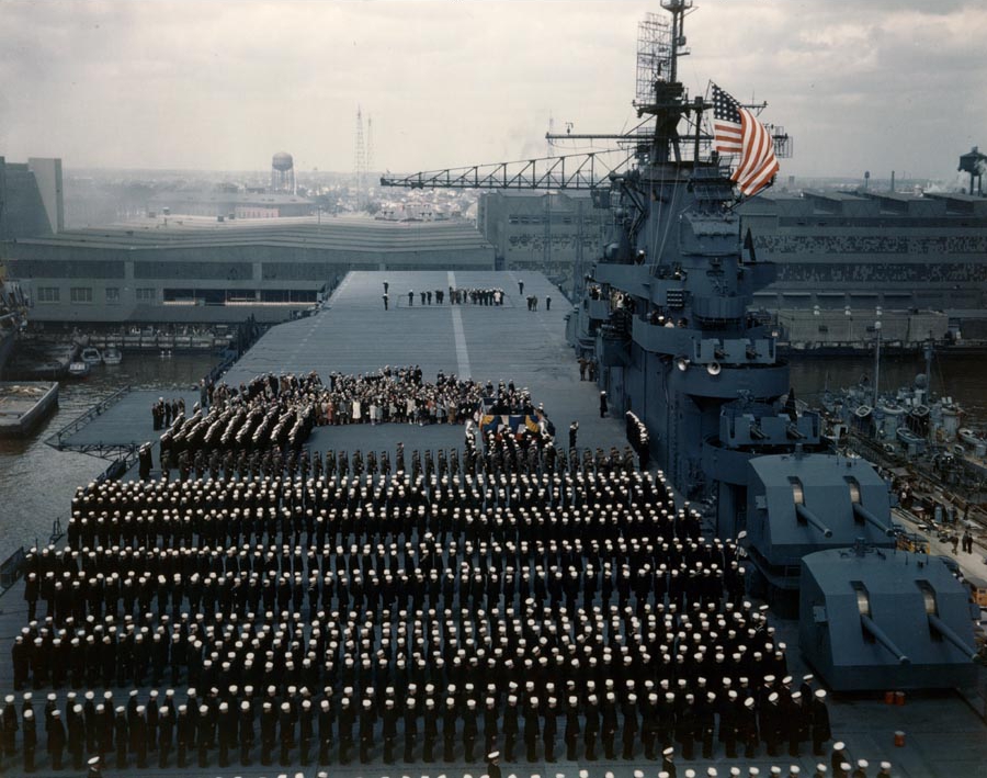 The colors being hoisted for the first time aboard the USS Yorktown (Essex-class) during the ship’s commissioning ceremonies, 15 Apr 1943 at Norfolk, Virginia, United States