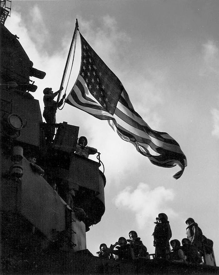 Battle Flag (larger flag) hoisted on the aircraft carrier Ticonderoga on orders issued throughout the fleet from Third Fleet Commander William Halsey in response to news that Japan had surrendered, 15 Aug 1945