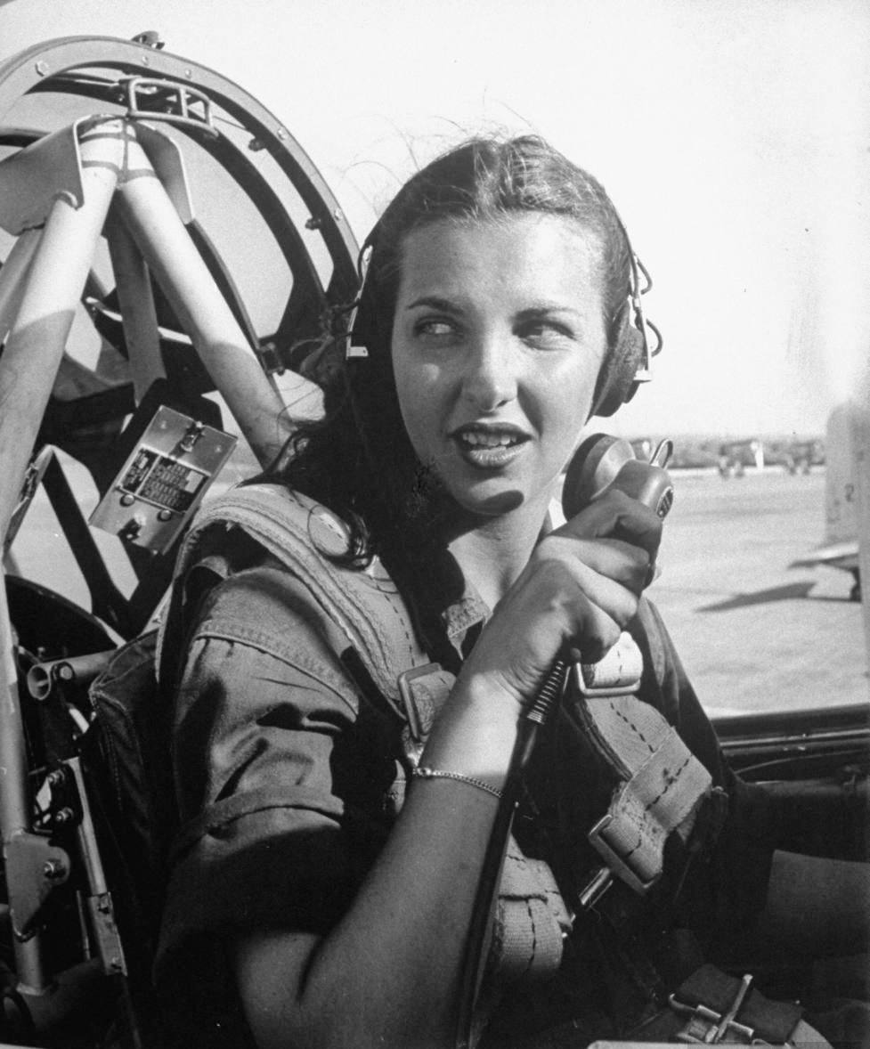 WASP pilot Nancy Nesbit seated in the cockpit of an AT-6 Texan at Love Field, Dallas, Texas, United States, 1944