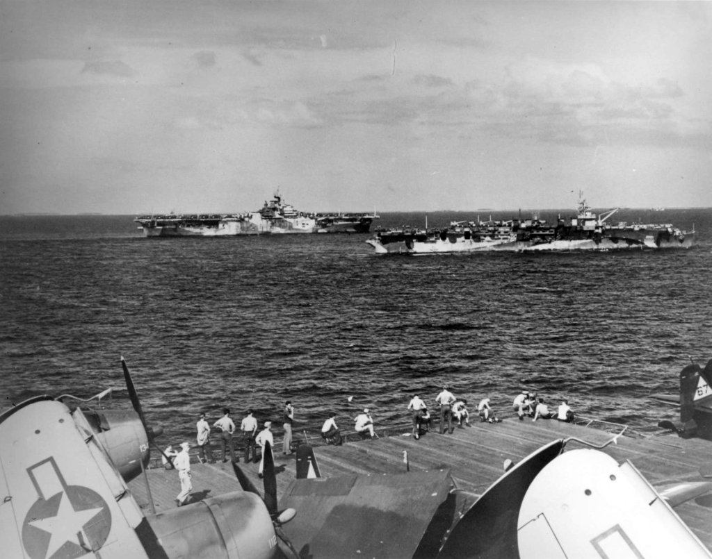 USS Hornet (Essex-class), distance, steaming with USS Langley (Independence-class) and USS Enterprise on their way back to Ulithi Atoll in the Caroline Islands, 25 Jan 1945.