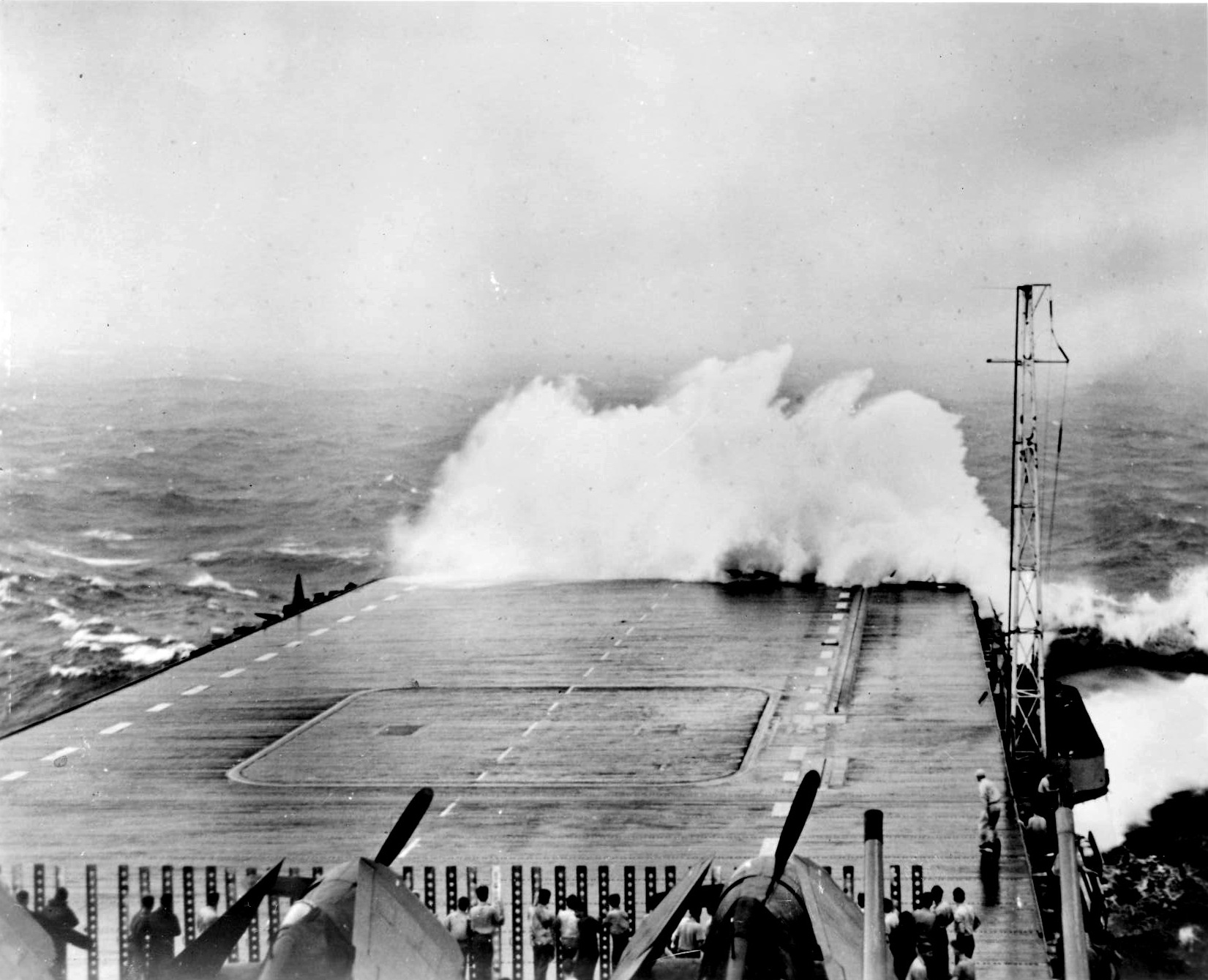 USS Hornet (Essex-class) taking white water over the bow in heavy seas during Typhoon Connie off Okinawa, 5 Jun 1945. Hornet would soon take green water over the bow that collapsed the forward 24 feet of her flight deck.
