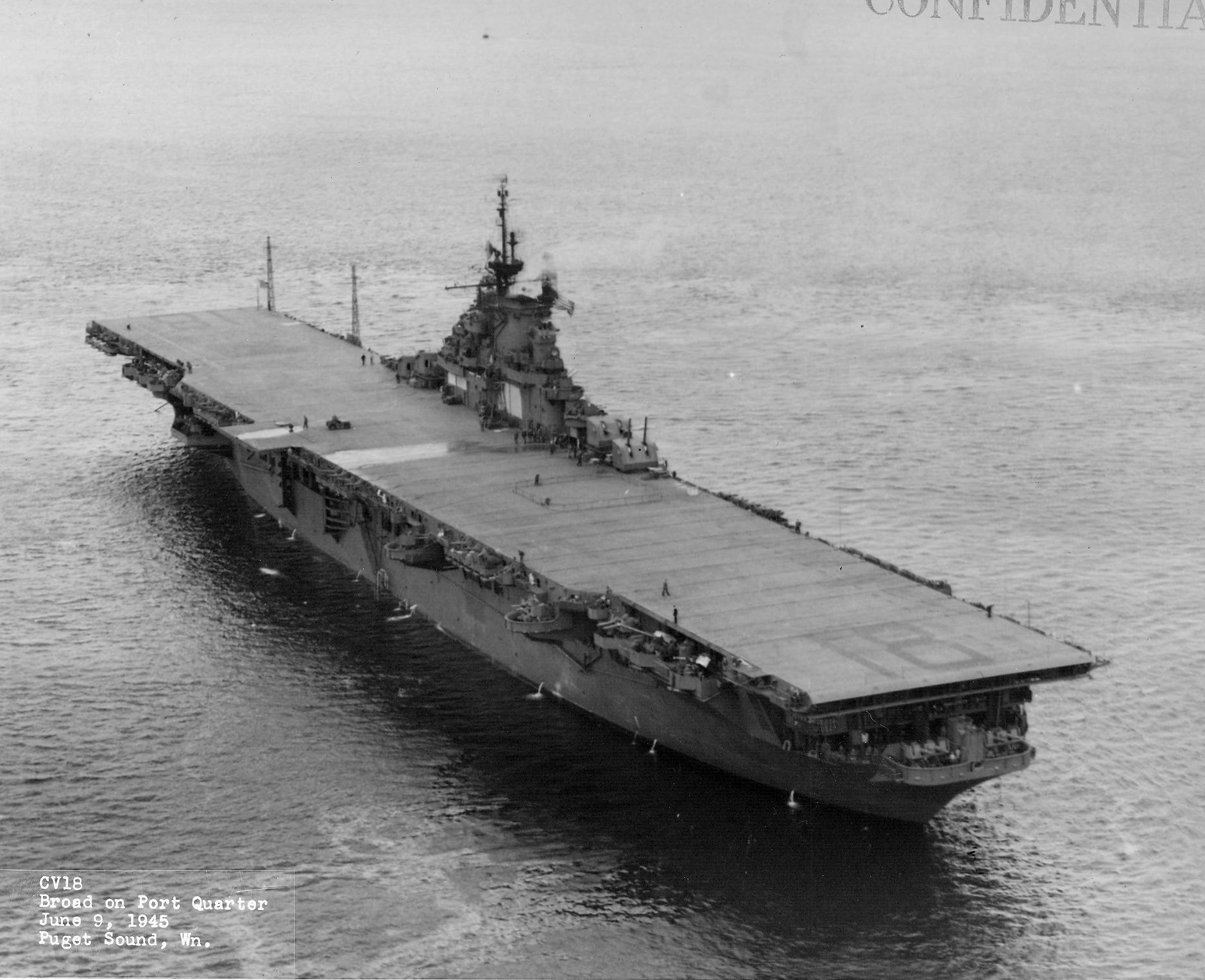 USS Wasp (Essex-class) just before departing Puget Sound Navy Yard, Bremerton, Washington, United States bound for San Francisco, California, 9 Jun 1945. Note new Measure 21 paint scheme, all over sea blue. Photo 3 of 5