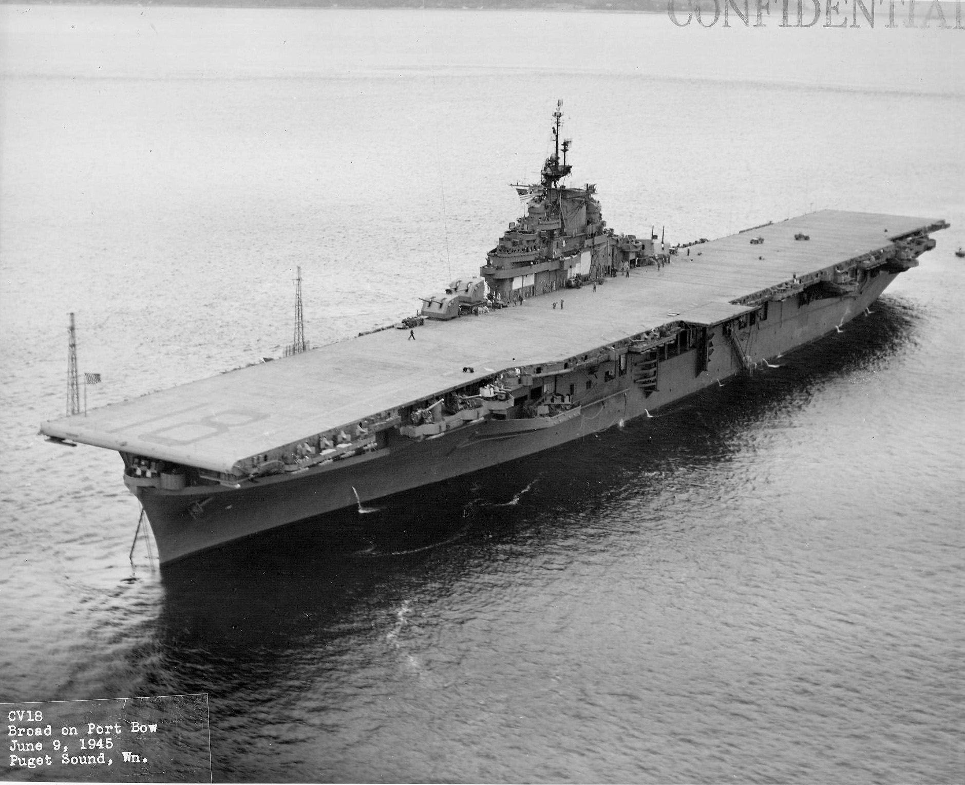 USS Wasp (Essex-class) just before departing Puget Sound Navy Yard, Bremerton, Washington, United States bound for San Francisco, California, 9 Jun 1945. Note new Measure 21 paint scheme, all over sea blue. Photo 4 of 5