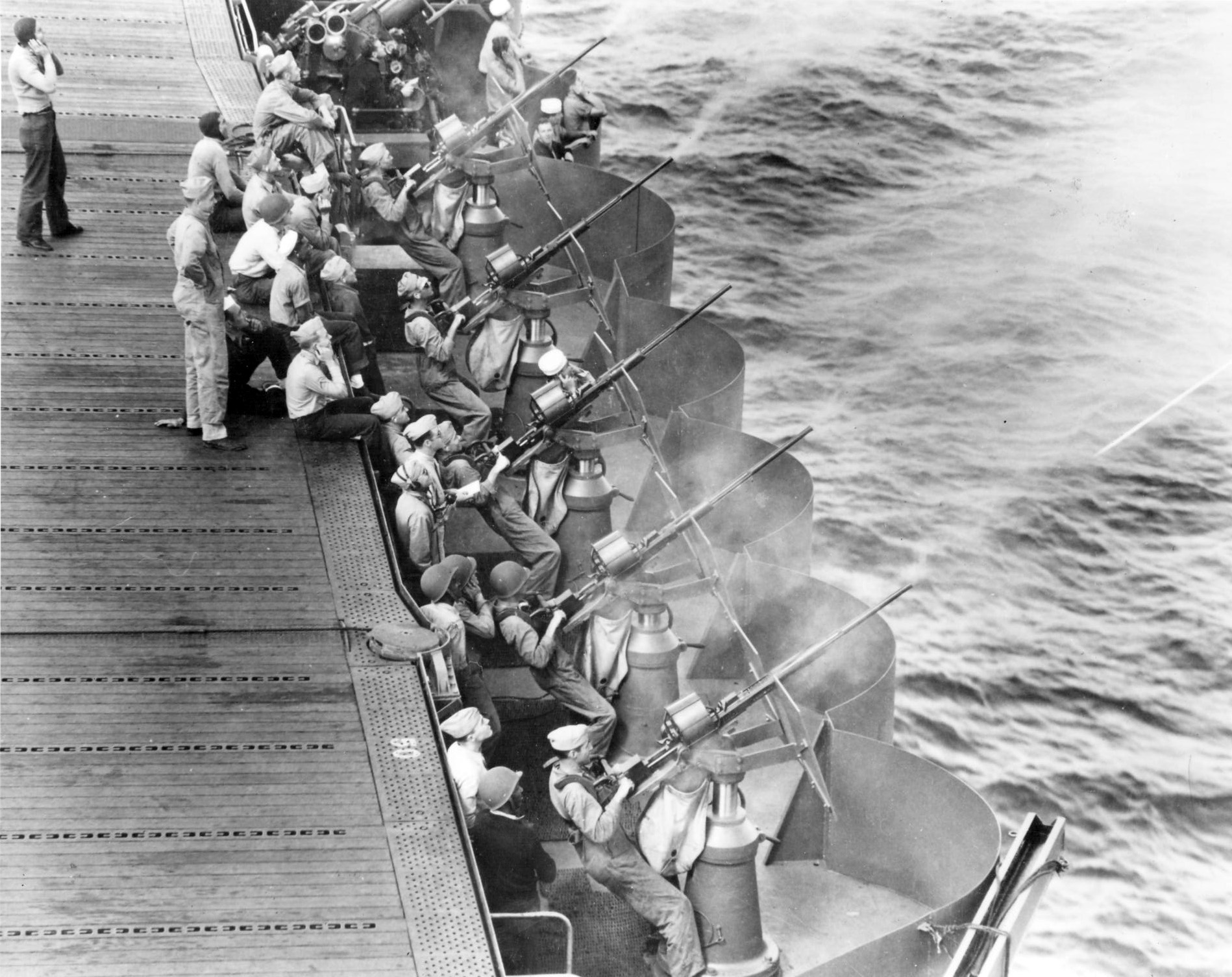 USS Enterprise gunnery crews practice with their 20mm anti-aircraft guns off Hawaii, May 1942.
