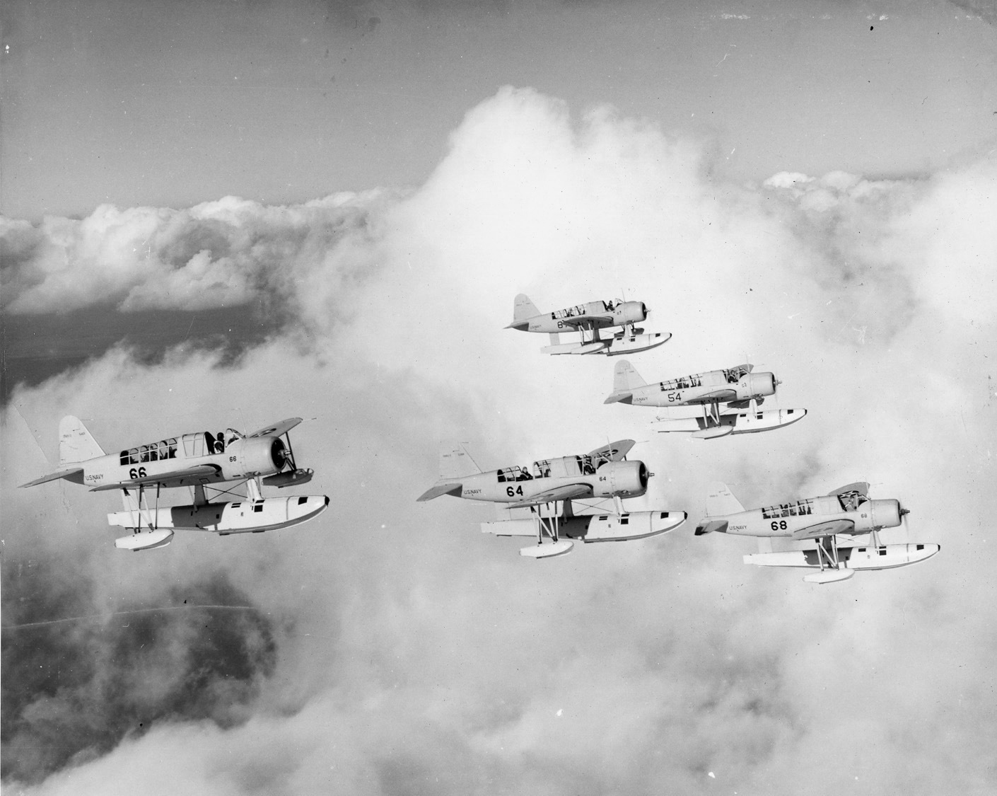 Naval Aviation Cadets from the Naval Air Station at Corpus Christi practicing formation flying in Chance-Vought OS2U Kingfisher float aircraft, Texas, United States, circa early 1940.