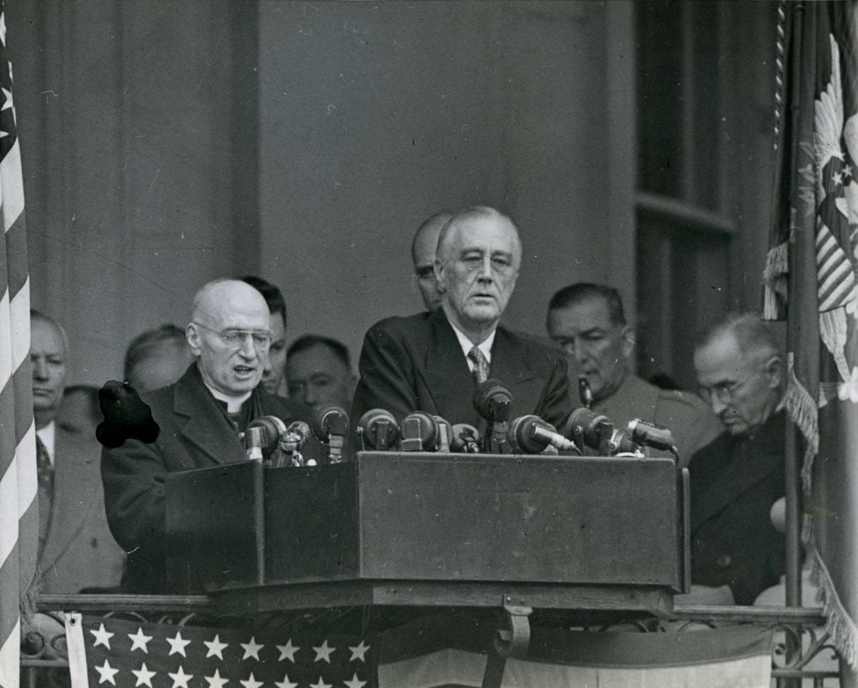 President Franklin Roosevelt during his inauguration ceremony on the west portico of the White House, Washington DC, United States, 20 Jan 1945. Note Harry Truman seated on the dias.
