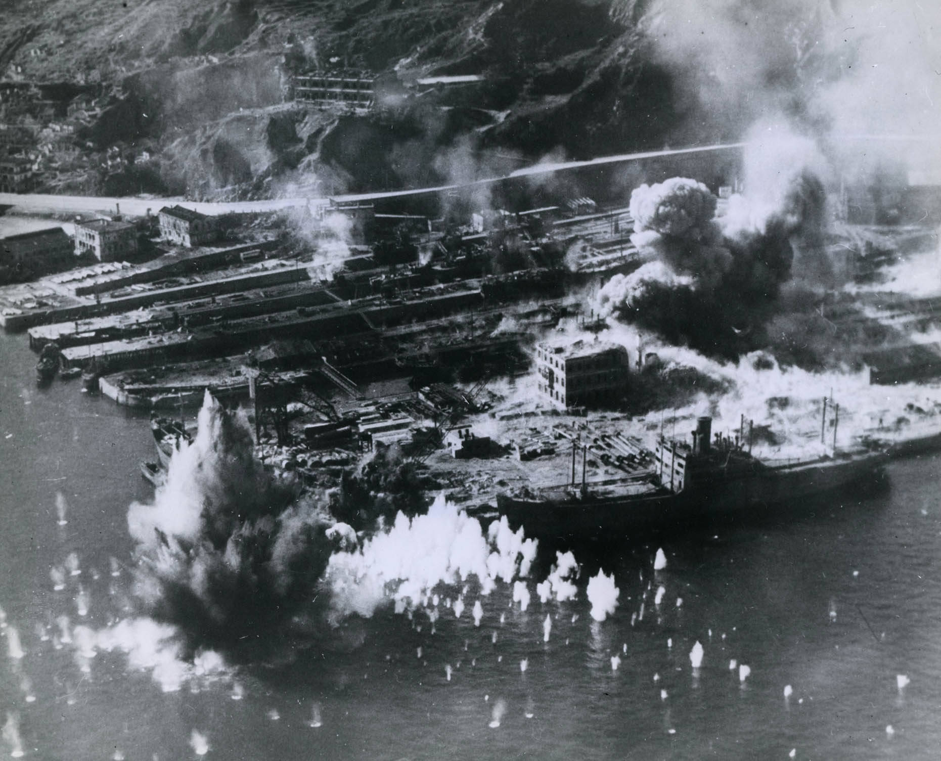 Taikoo Dockyard facilities under American aerial attack, Hong Kong, 16 Jan 1945. Photo 2 of 2
