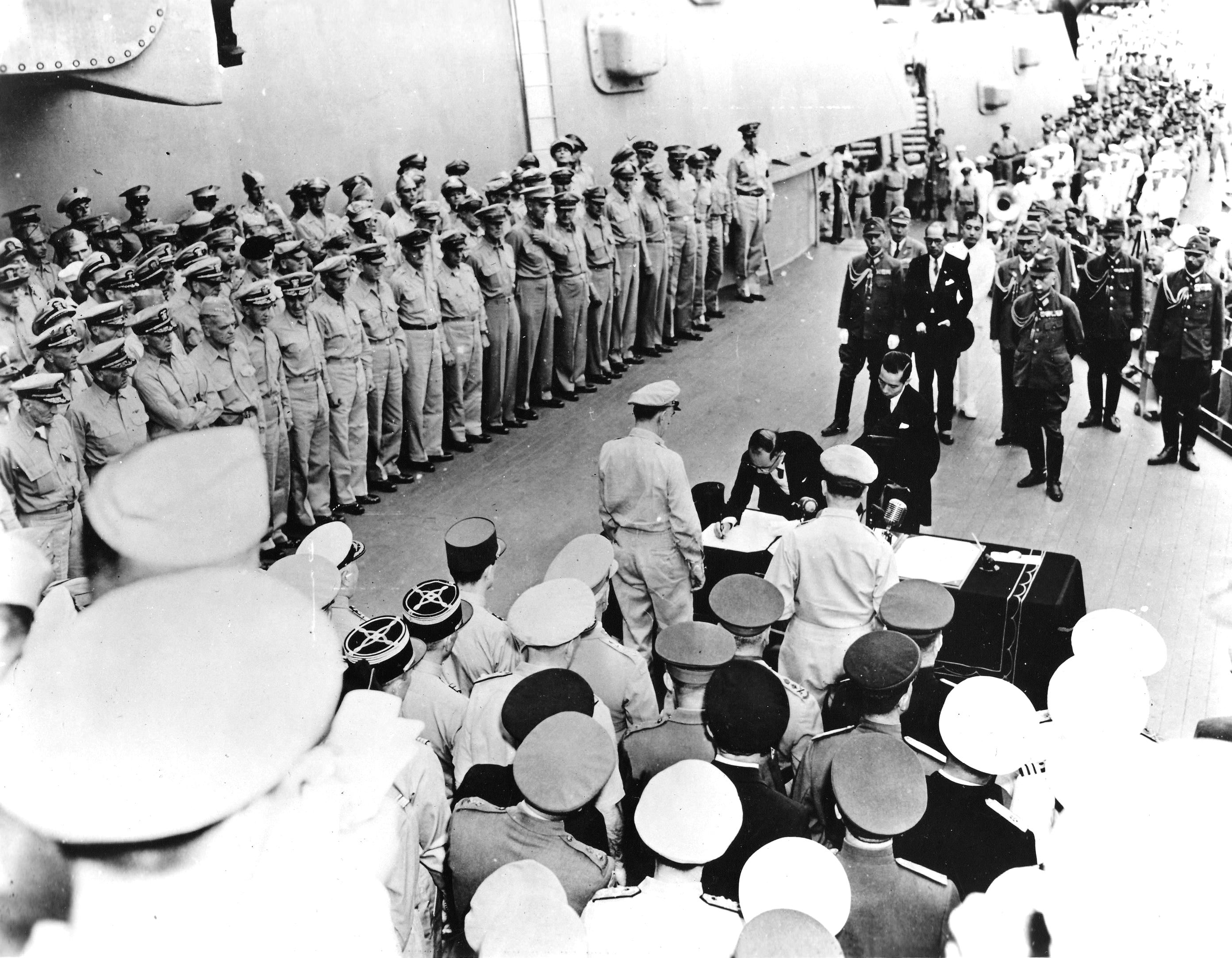 Mamoru Shigemitsu signing the surrender instrument aboard USS Missouri, Tokyo Bay, Japan, 2 Sep 1945, photo 4 of 4