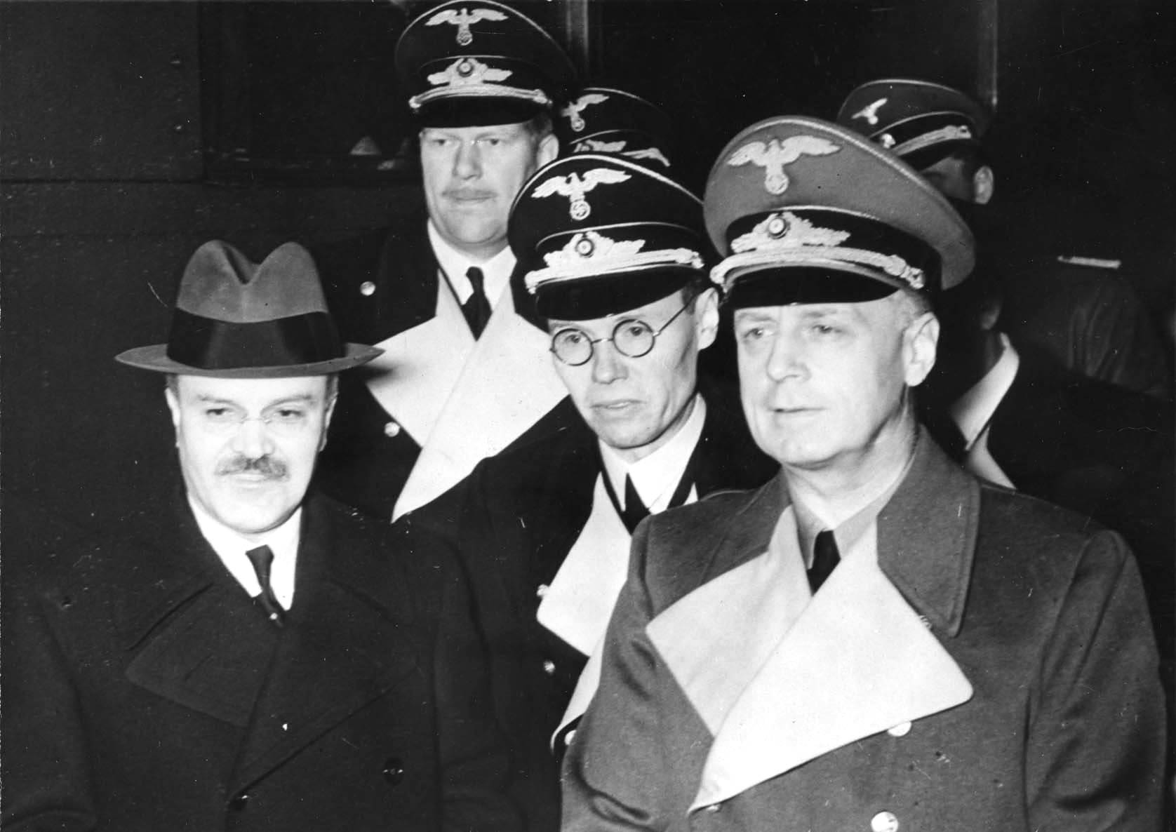 Vyacheslav Molotov and Joachim von Ribbentrop at Anhalter Station, Berlin, Germany, 14 Nov 1940. They are escorted by Foreign Office staff members Baron Alexander Von Dörnberg (2m tall) and Gustav Hilger (glasses)