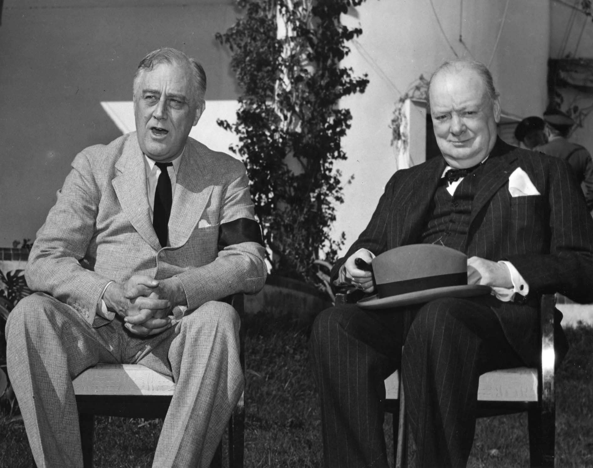 Franklin Roosevelt and Winston Churchill pose for photographs in the gardens of Roosevelt’s Villa Dar es Saada in the Anfa neighborhood of Casablanca, French Morocco during the Casablanca Conference, 24 Jan 1943.