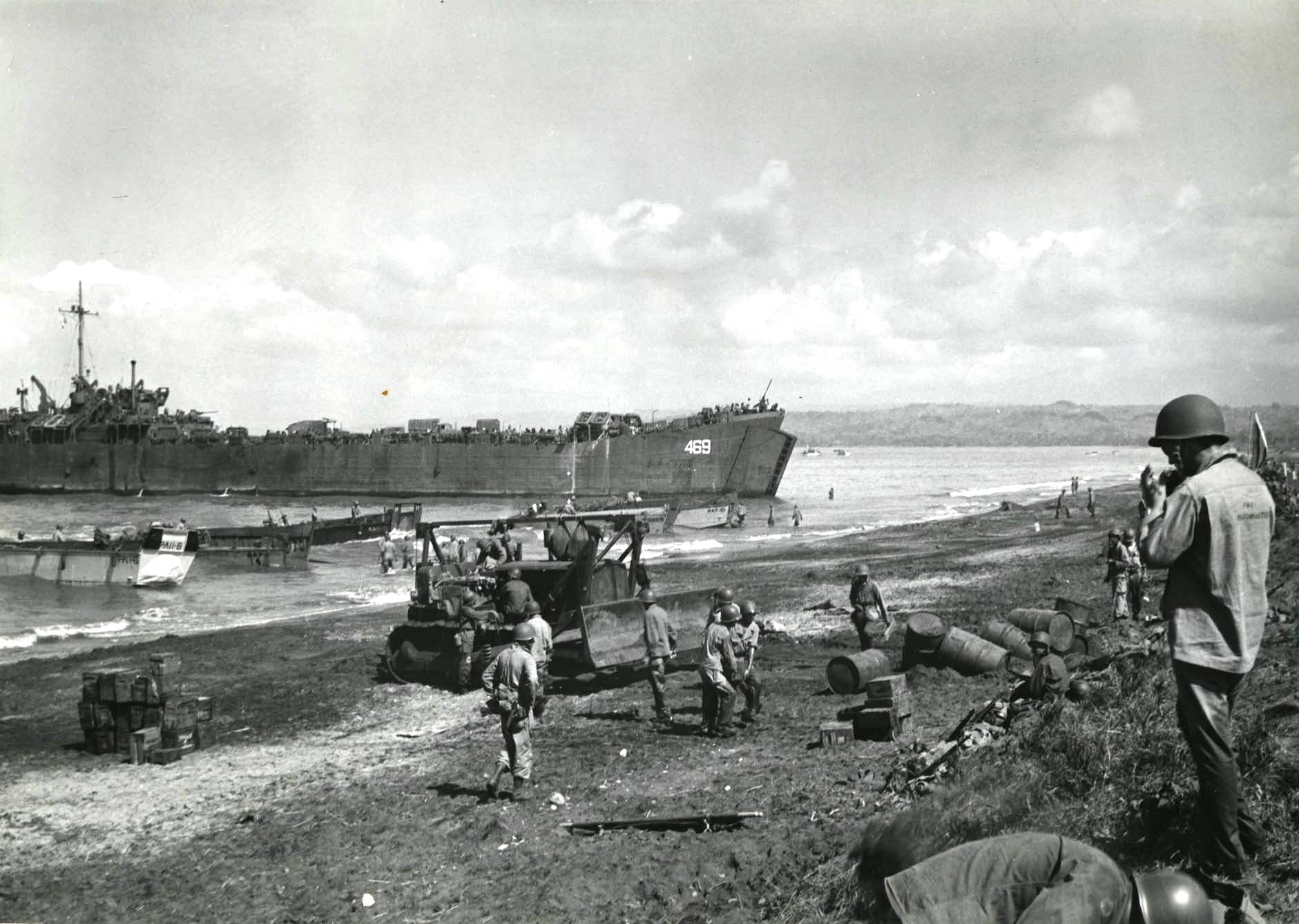 LSTs and LCVPs unloading men, equipment, and provisions on White Beach Two in Lingayen Gulf, Luzon, Philippine Islands, 9 Jan 1945.