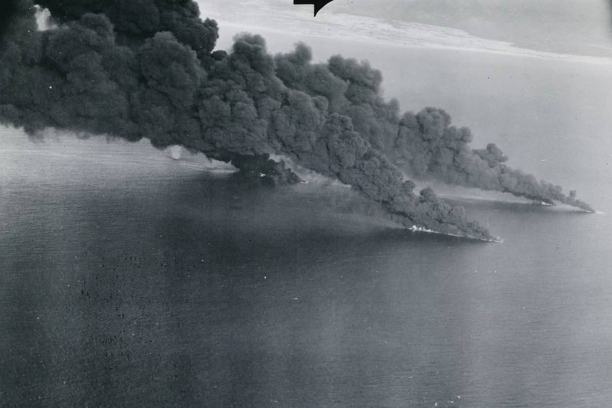 Japanese shipping burning furiously after attacks from US carrier aircraft off the coast of French Indochina (Vietnam), 12 Jan 1945.