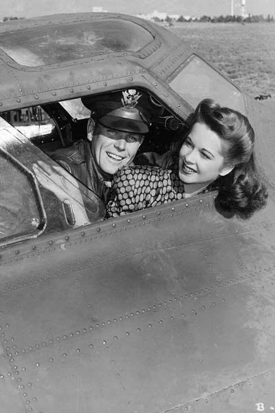 American entertainer Margie Stewart in the cockpit of a B-17 Flying Fortress during the filming of the movie 'Bombardier', Kirtland Field, Albuquerque, New Mexico, United States, 1942