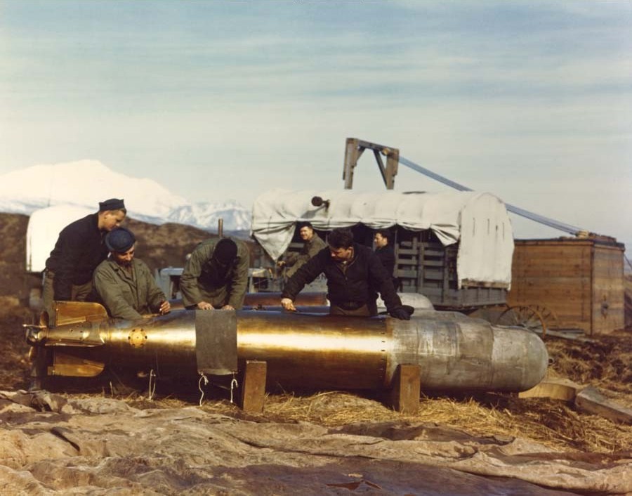 United States Navy ordinancemen servicing a Mark XIII torpedo at a Naval air station in the Aleutian Islands, Jun-Aug 1943