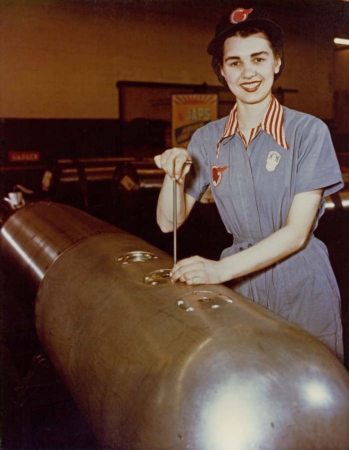 A factory worker at General Motors’ Pontiac Assembly Plant, converted to wartime production, making adjustments to a Mark XIII aerial torpedo, Pontiac, Michigan, United States, early 1944
