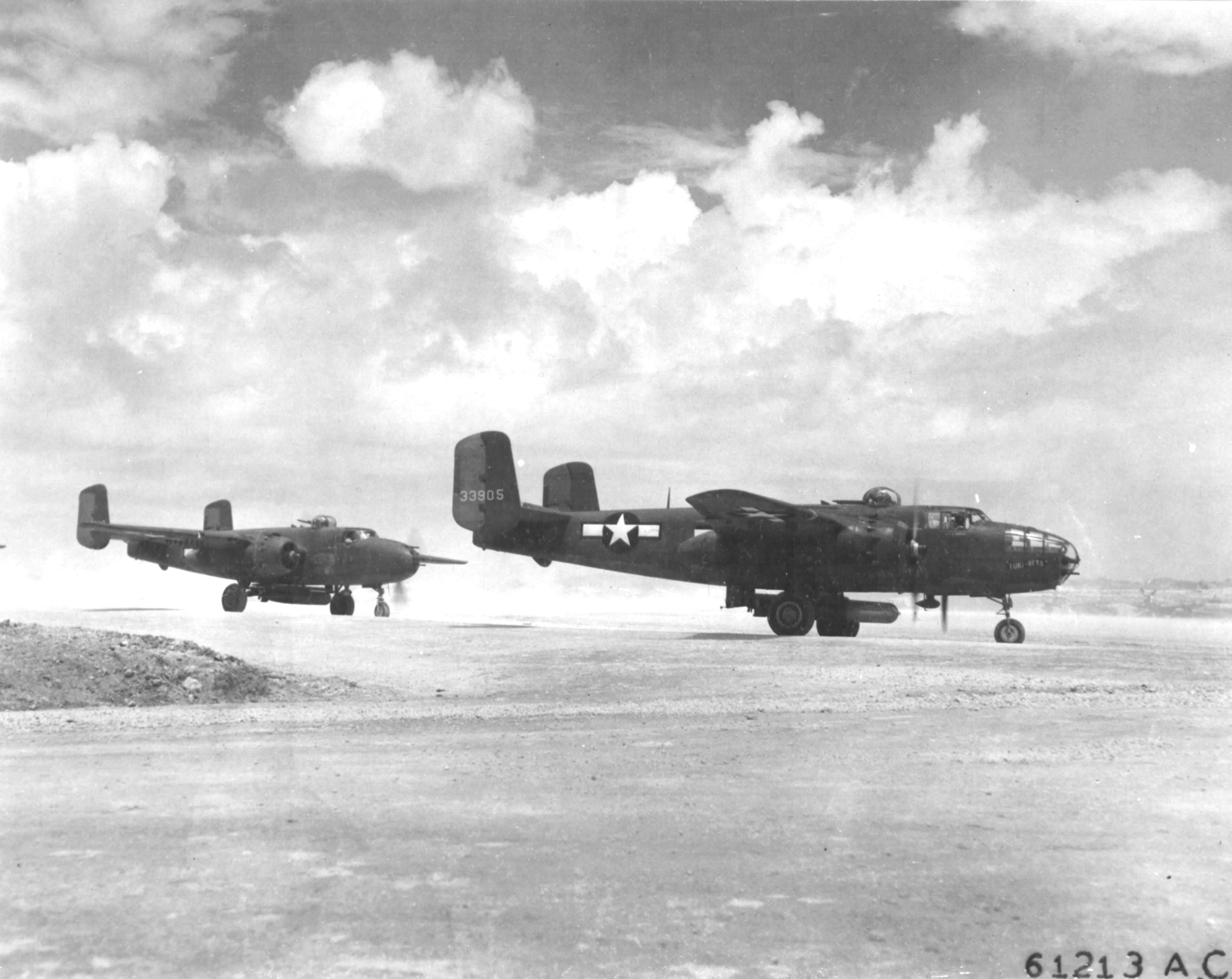 B-25J Mitchell bombers of the 41st Bomb Group armed with Mark XIII torpedoes prepare for take-off from Yonton Airfield, Okinawa bound for an attack on Japanese shipping at Sasebo, Japan, 28 Jul 1945.