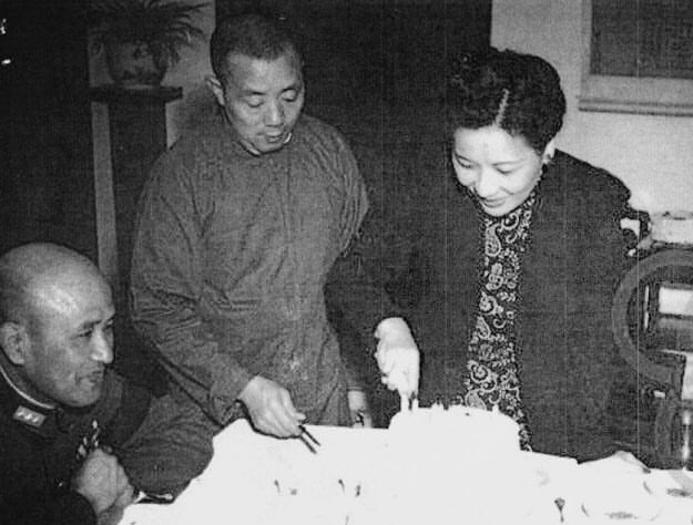 Bai Chongxi and Song Meiling preparing a birthday cake for Chiang Kaishek, Chongqing, China, 31 Oct 1945