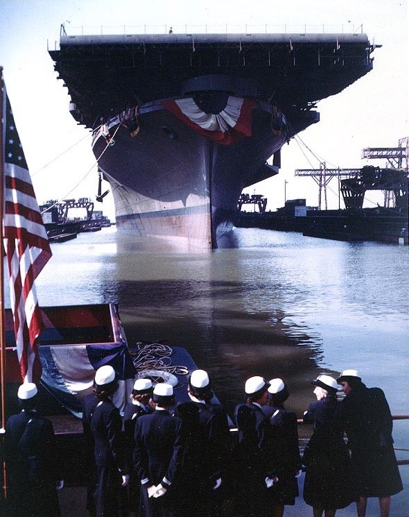 USS Franklin being floated out of drydock for the first time, Newport News, Virginia, United States, 14 Oct 1943. Note Navy WAVES on the dock; WAVES' Director, LtCdr Mildred H. McAfee, USNR, was Franklin's sponsor.