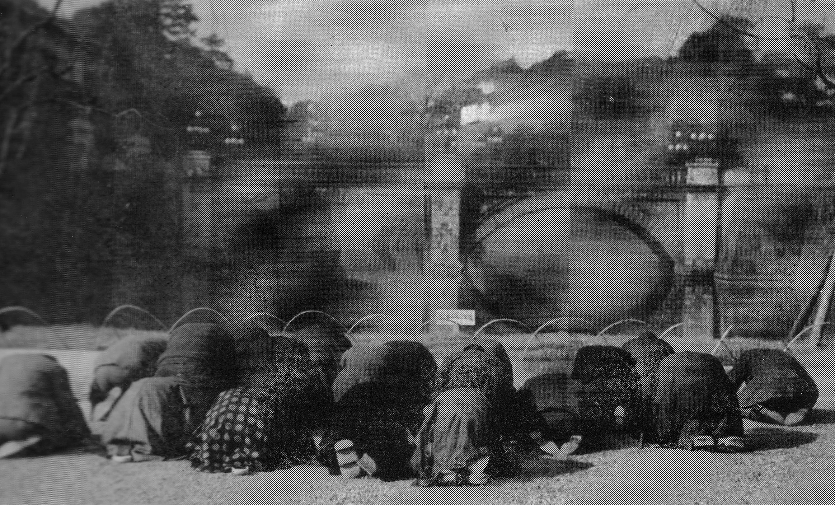 Japanese civilians outside the Imperial Palace near the Nijubashi bridges, Tokyo, Japan, 15 Aug 1945, photo 1 of 2