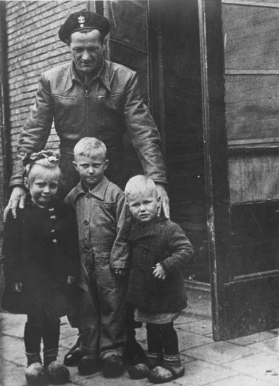 Polish Amored Division soldier with Dutch children, the Netherlands, 1945