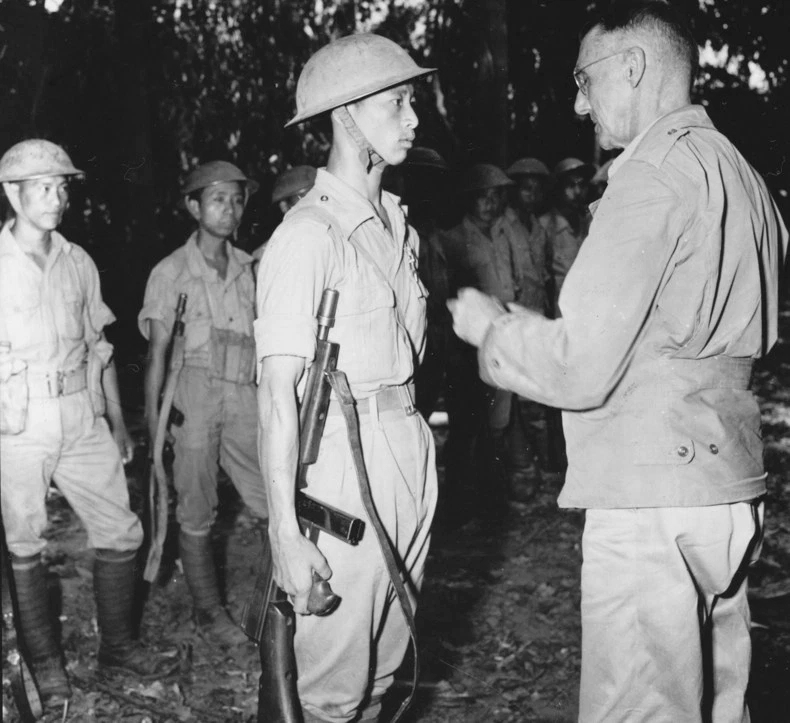 Lieutenant General Joseph Stilwell awarding a Silver Star medal to a Chinese soldier in the field, about six miles south of Laban, northern Burma, 28 Apr 1944