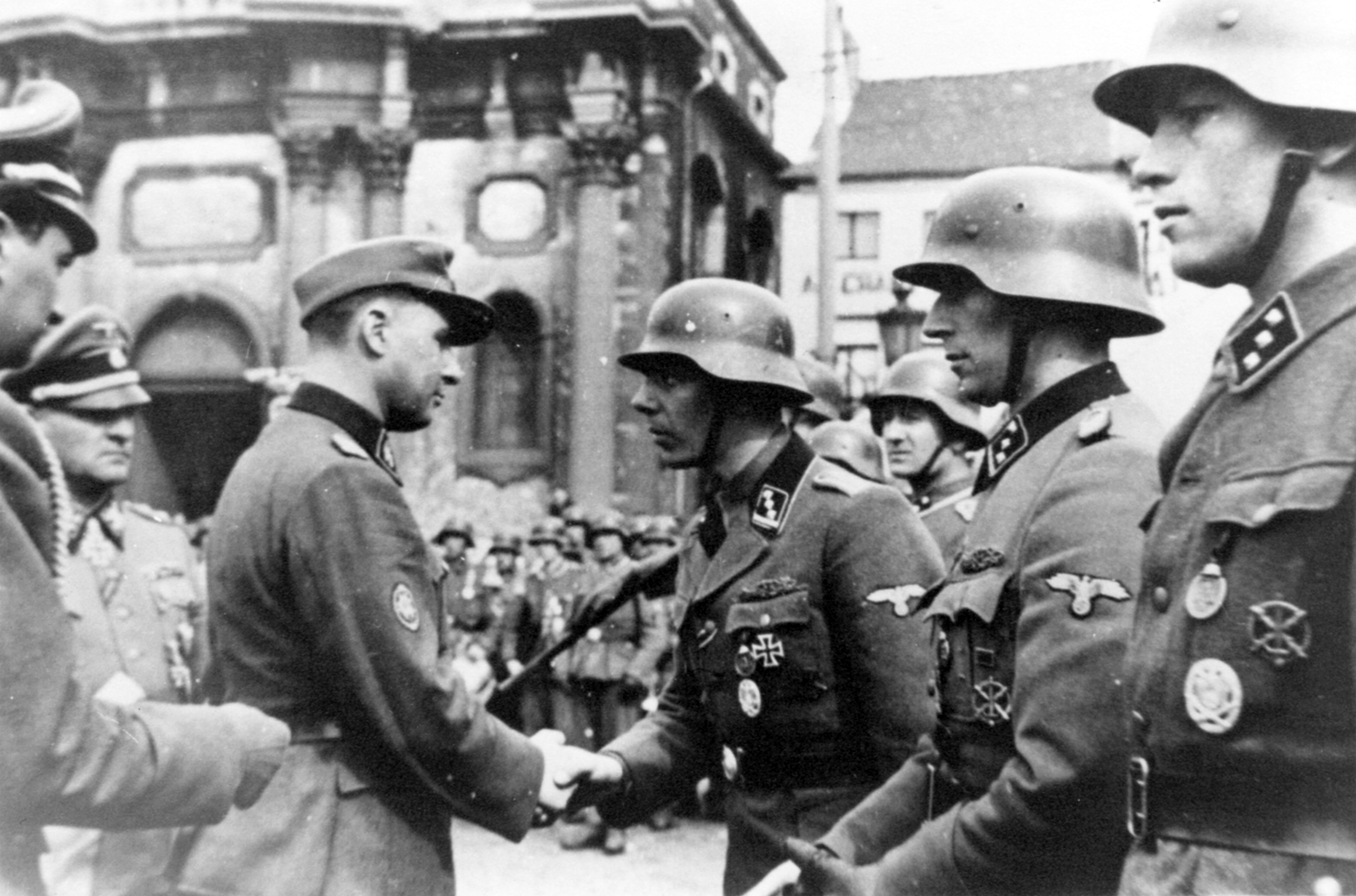 Léon Degrelle speaking to troops at Charleroi, Hainaut, Belgium, 1 Apr 1944; note Josef Dietrich in background