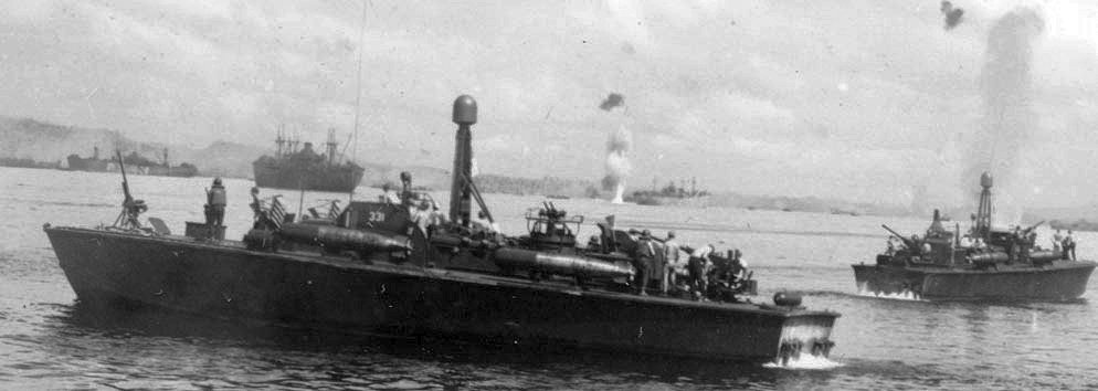 PT-331, an Elco 80-footer of Motor Torpedo Boat Squadron 21 (MTBRon 21), in Leyte Gulf, 1945. Note shell splashes in the distance.