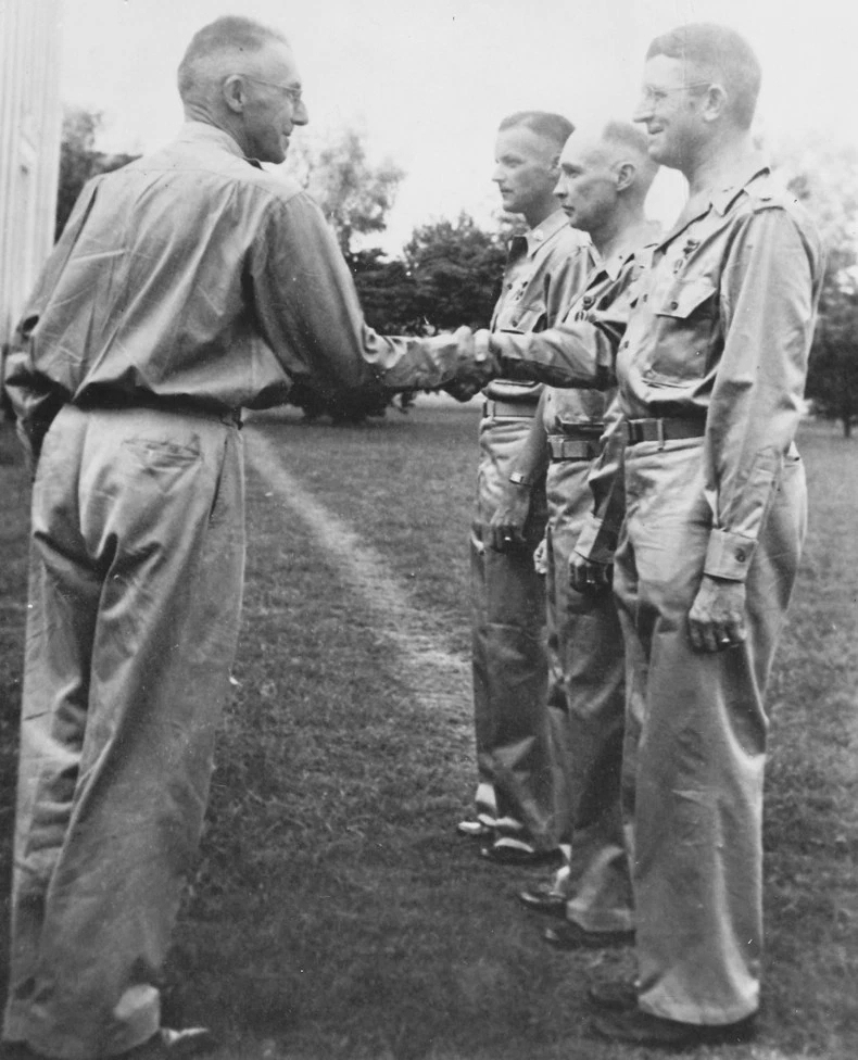 Lieutenant General Joseph Stilwell awarding the Purple Heart medal to Lieutenant Colonel Frank Merrill, India, 1942