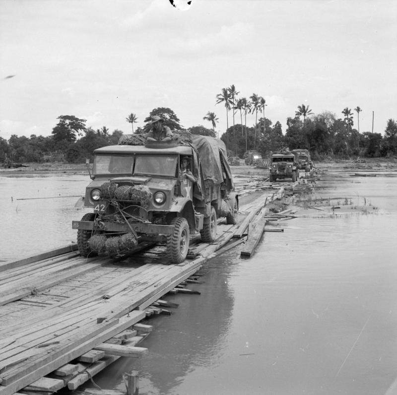British Army convoy of Canadian Chevrolet CMP 3-ton trucks crossing a temporary bridge in Burma on their way to Rangoon (now Yangon), 26 Apr 1945.
