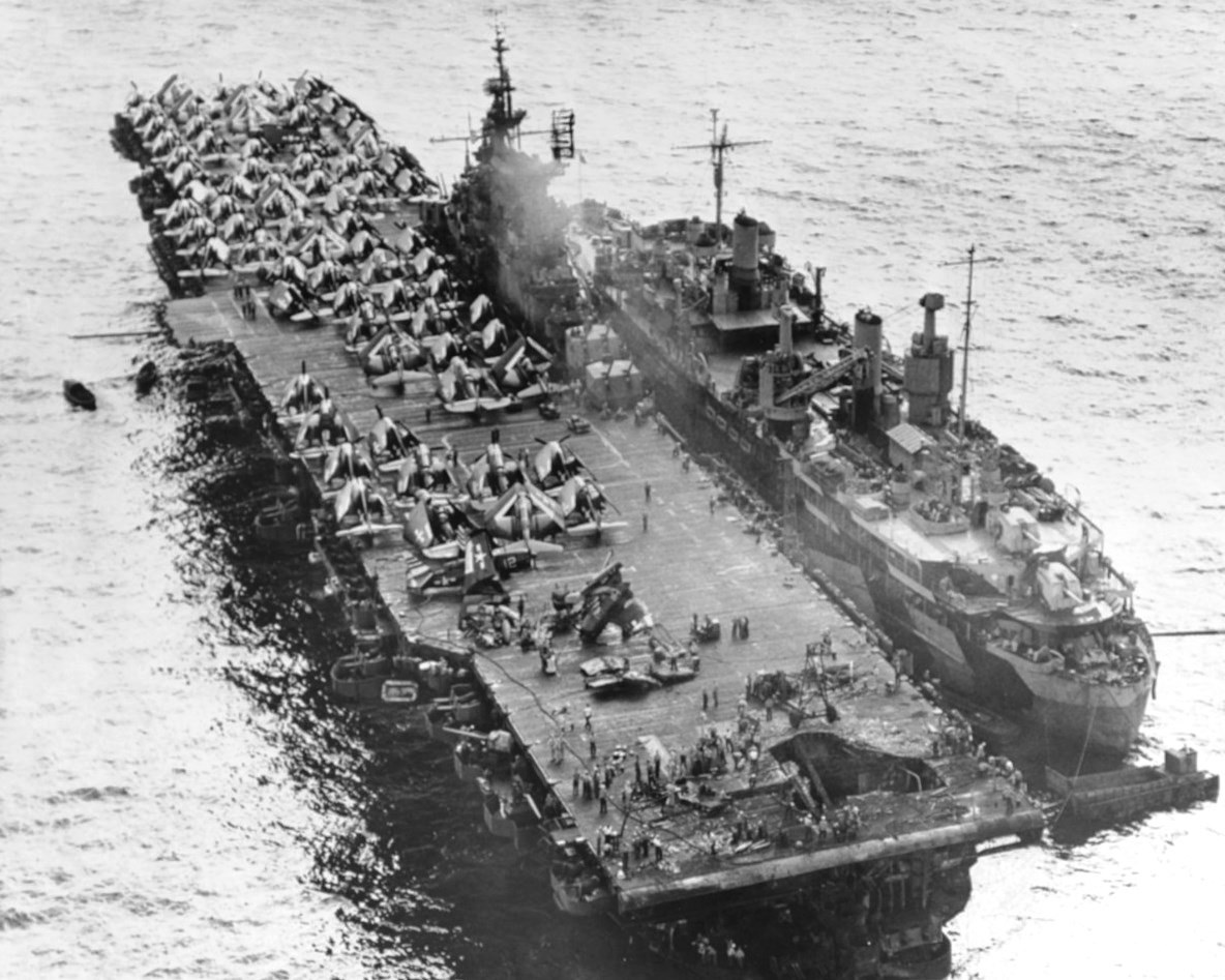 13 Mar 1945 photo of the Essex-class carrier USS Randolph with damage to her flight deck as the result of a Japanese Yokosuka P1Y Ginga 