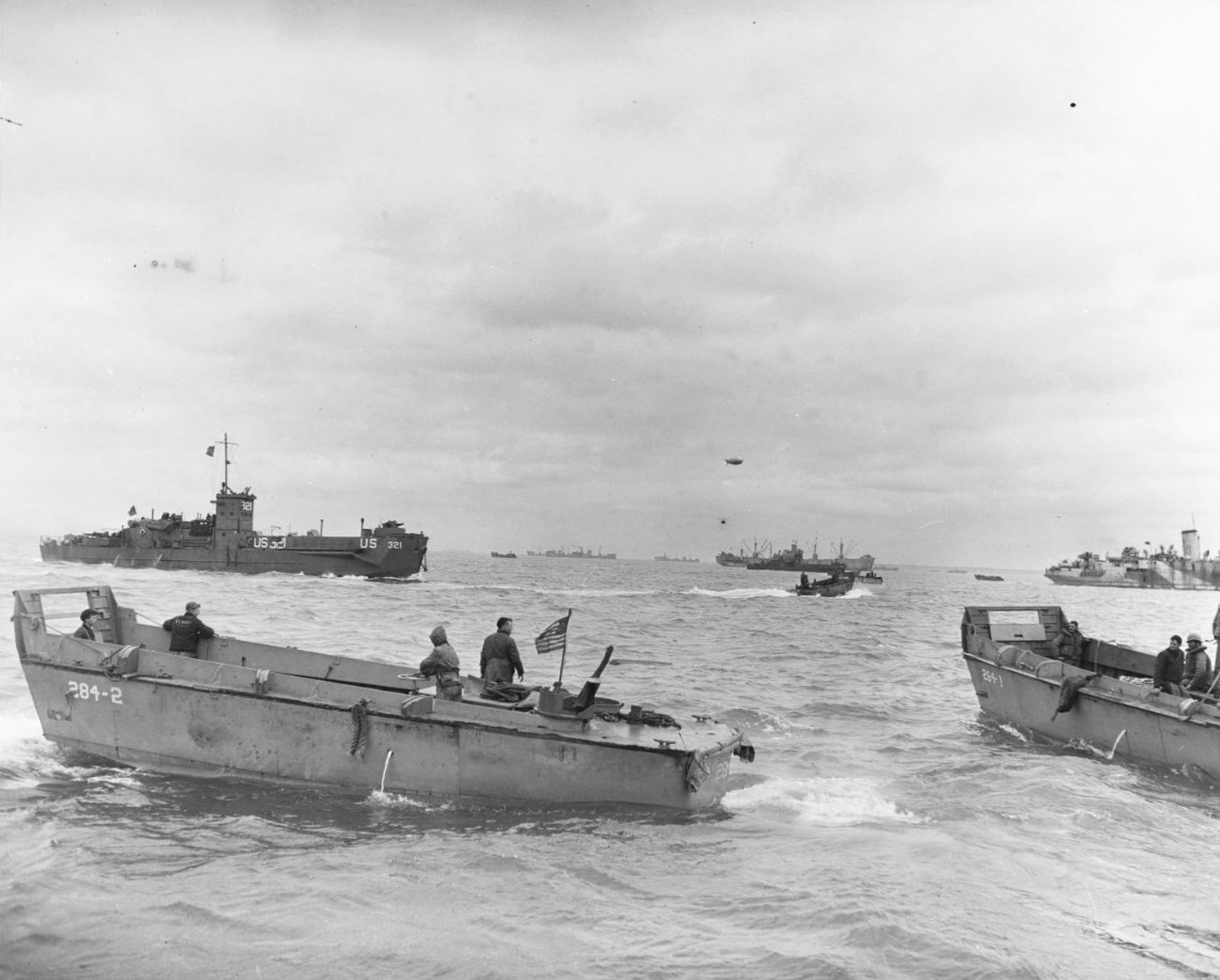 LCVP landing craft from LST-284 off Utah Beach, Normandy, France, 6 Jun 1944. LCI(L)-321 is in the background.