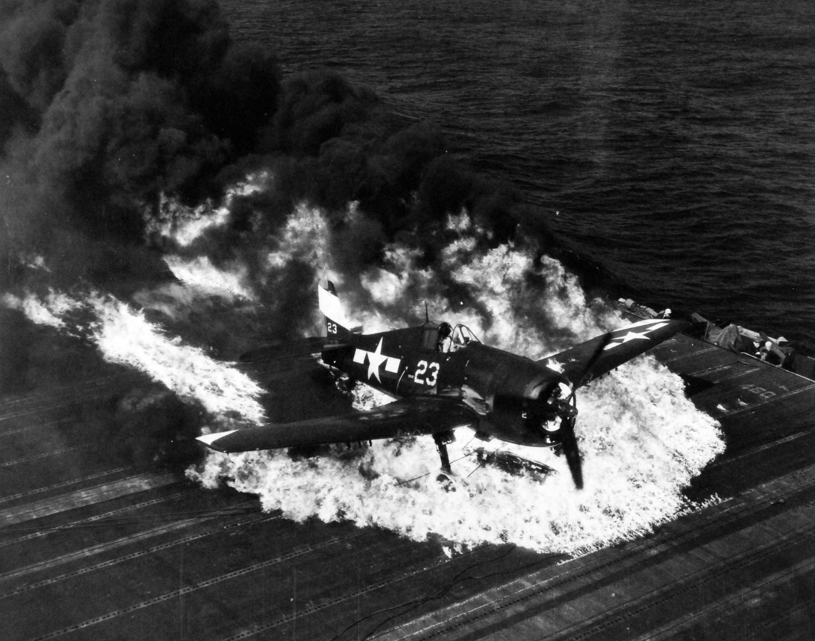 Ensign Ardon R. Ives of Fighting-Bombing Squadron VBF-9 crashed his F6F-5 Hellcat through the barrier on USS Lexington (Essex-class) and ruptured the center-line fuel tank, Feb 1945, western Pacific. Photo 4 of 7